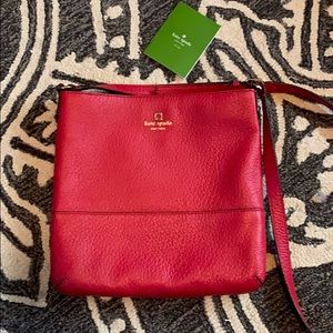 Red Cross body leather purse. New with out tags.